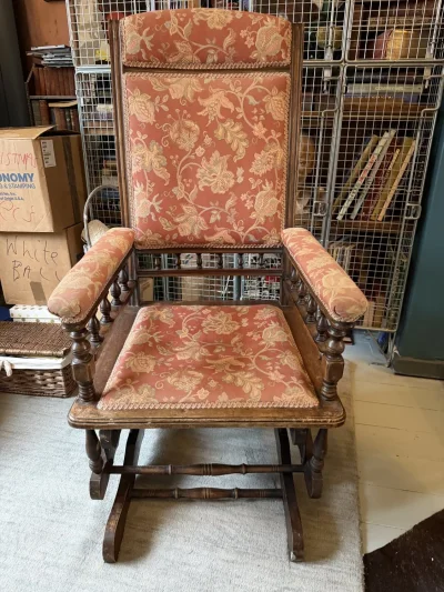 Vintage dark wood upholstered rocking armchair with floral fabric on Furnish Well
