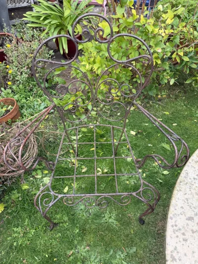 Vintage-style ornate metal garden armchair frame with scrollwork on Furnish Well