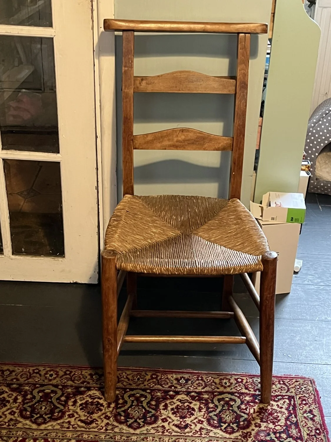Vintage wooden church ladder-back dining chair with woven rush seat