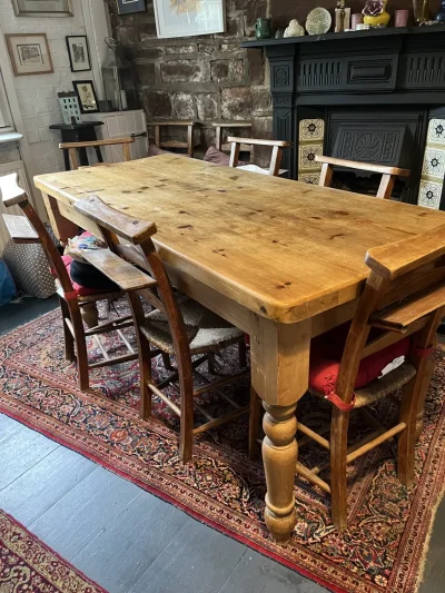 Vintage farmhouse pine dining table with turned legs and plank-style top on Furnish Well